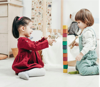 two kids playing with blocks