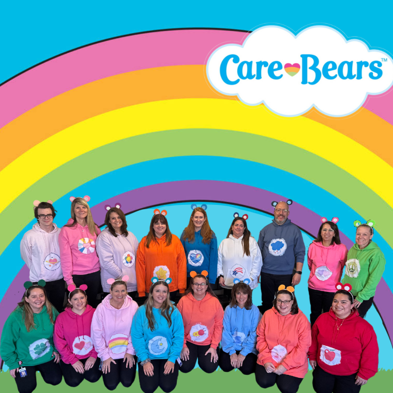 Staff photo of everyone dressed as care bears