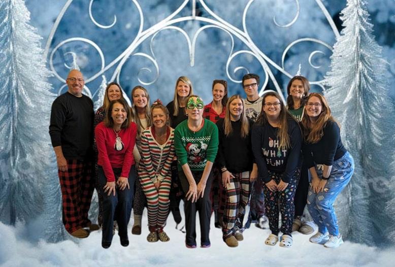 Staff posing in holiday pajamas