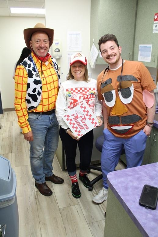 Three people posing as two story characters